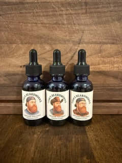 The Glorious Three Bundle "Premium Beard Oil - 3 1oz bottles" featuring Tink, Cowboy, and Lumberjack oils.
